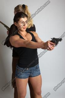 OXANA AND XENIA STANDING POSE WITH GUNS 3 (1)